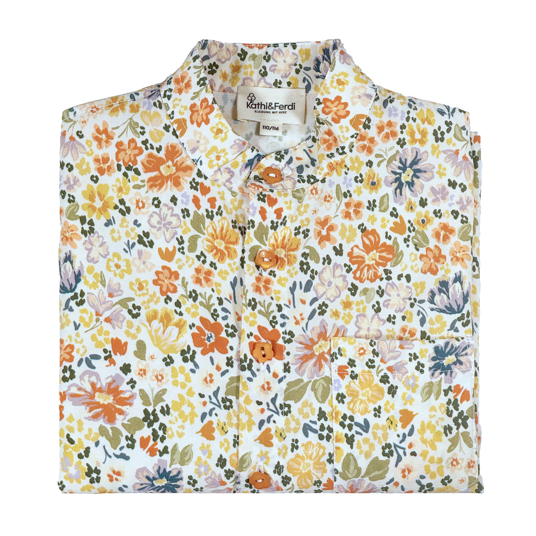 Kidnerbluse Blumen gefaltet
